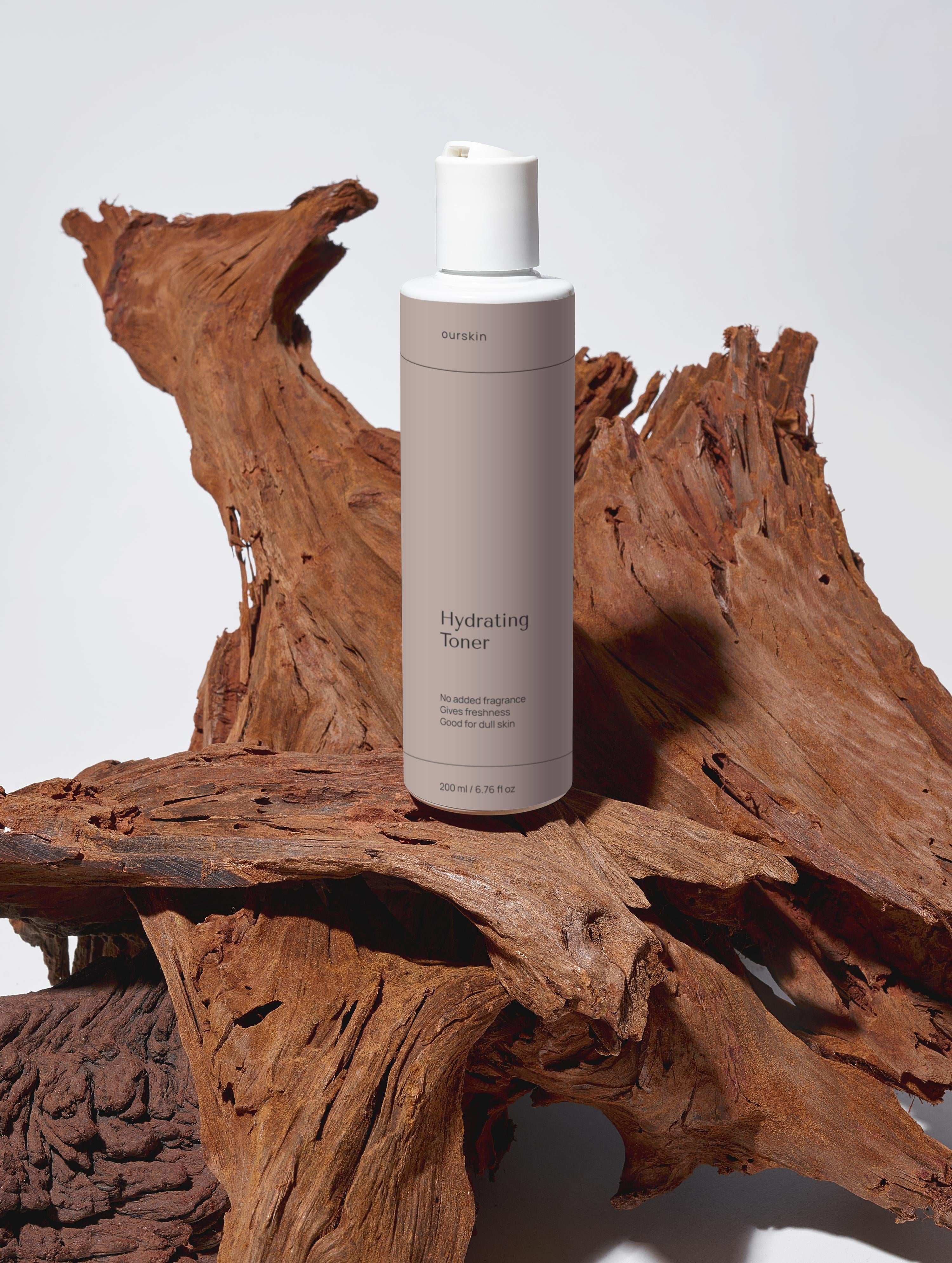 Hydrating toner bottle with rose water and hyaluronic acid for moisturizing and balancing skin